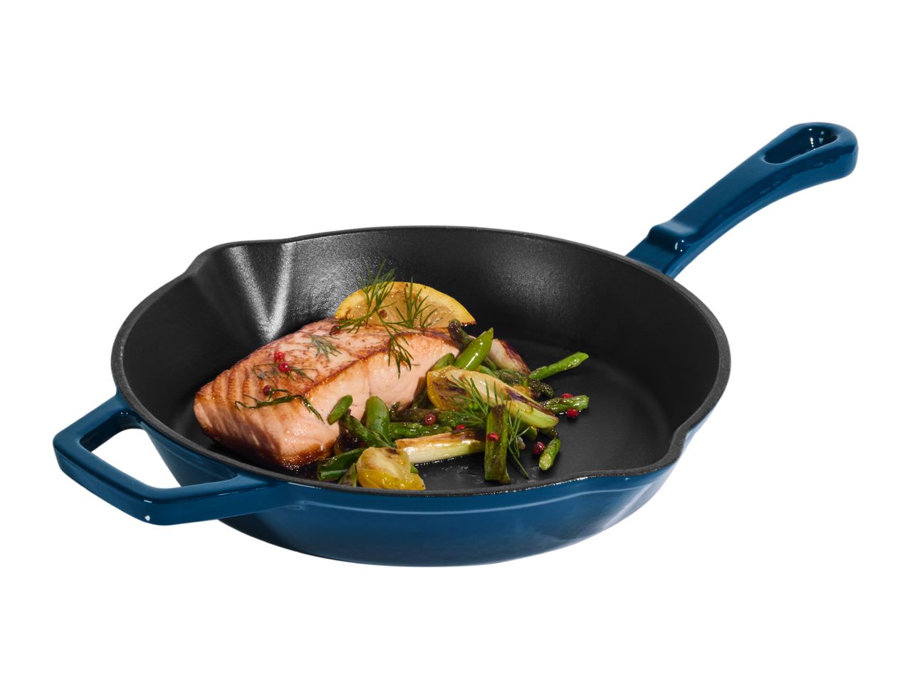 Cooked salmon fillet with asparagus and lemon in a blue cast iron skillet.