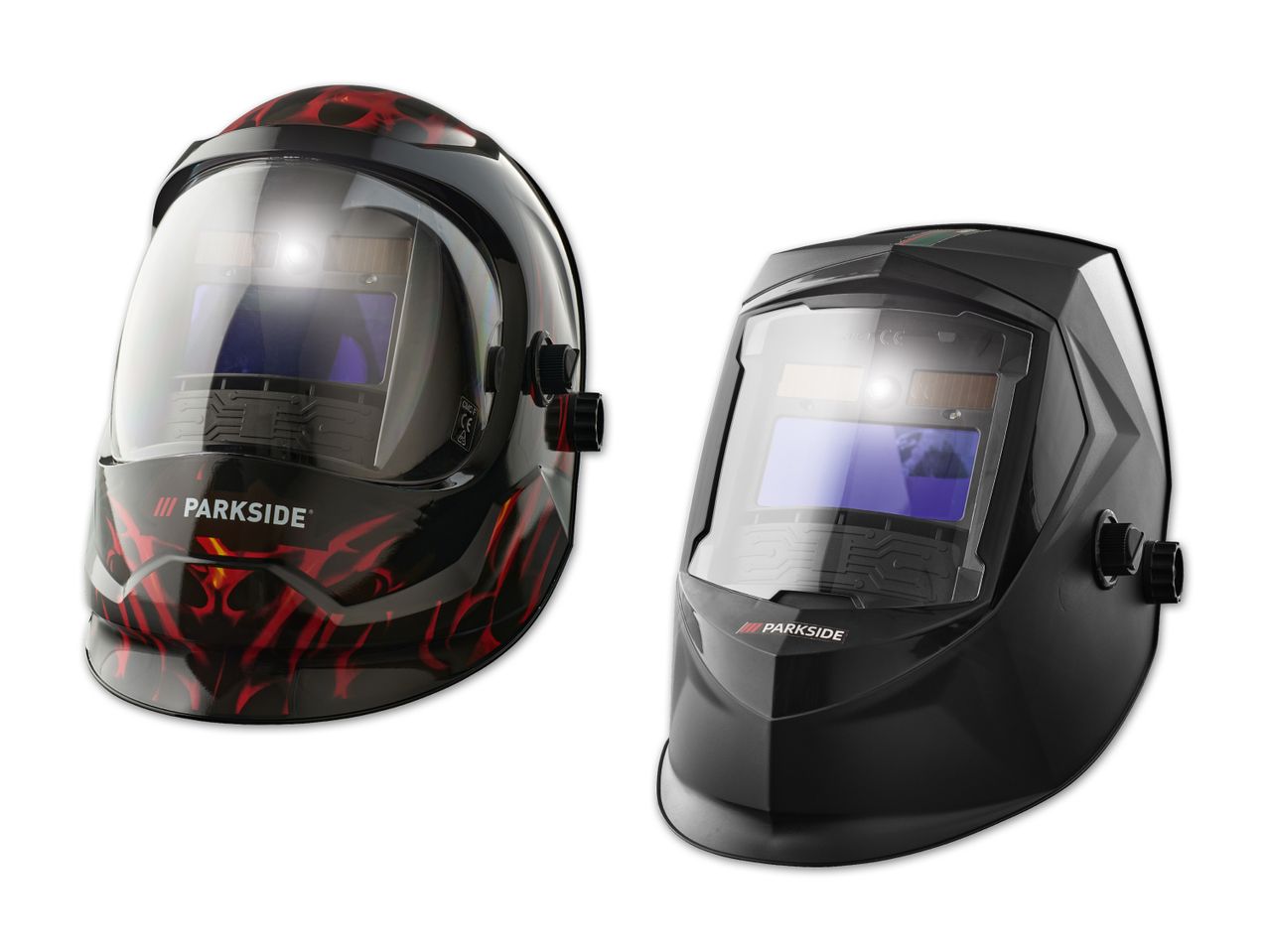 Zwei Parkside Schweißhelme, einer mit Flammen-Design, der andere schwarz.
