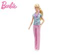 Barbie doctor doll in teal scrubs and pink pants, holding a stethoscope.