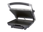 Open electric grill with ribbed cooking plates and a black handle.