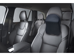ULTIMATE SPEED® Seat Pad/Cushion Assortment: Black mesh car headrest cushion in a car interior.