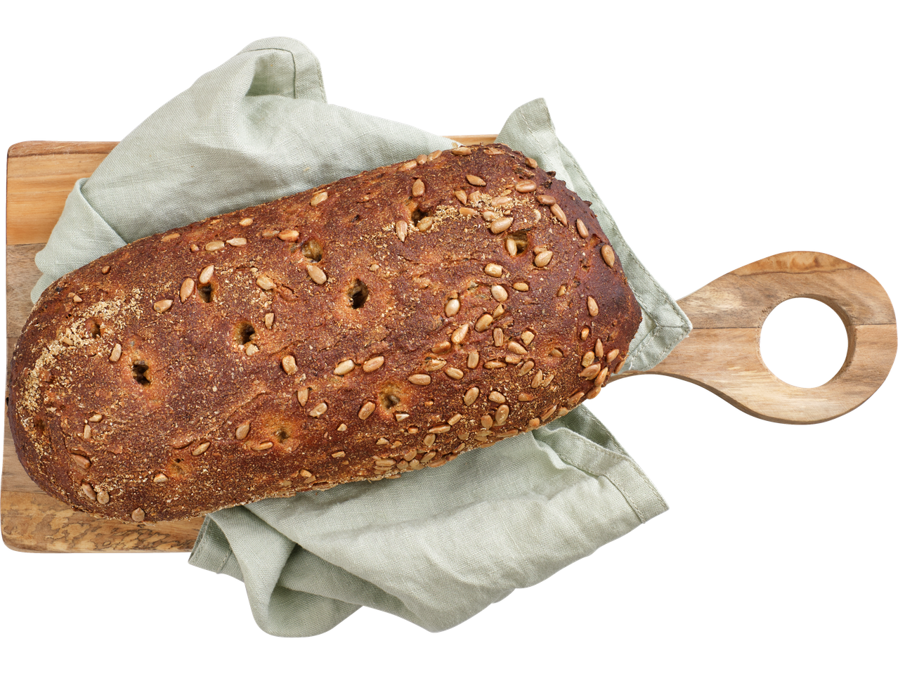 Päevalilleseemnetega leib puuplaadil.
