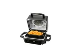 A black Cuisinart indoor grill cooks food.