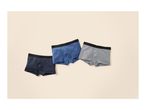 Three men's boxer briefs in navy, blue, and grey, with black waistbands, on a light background.