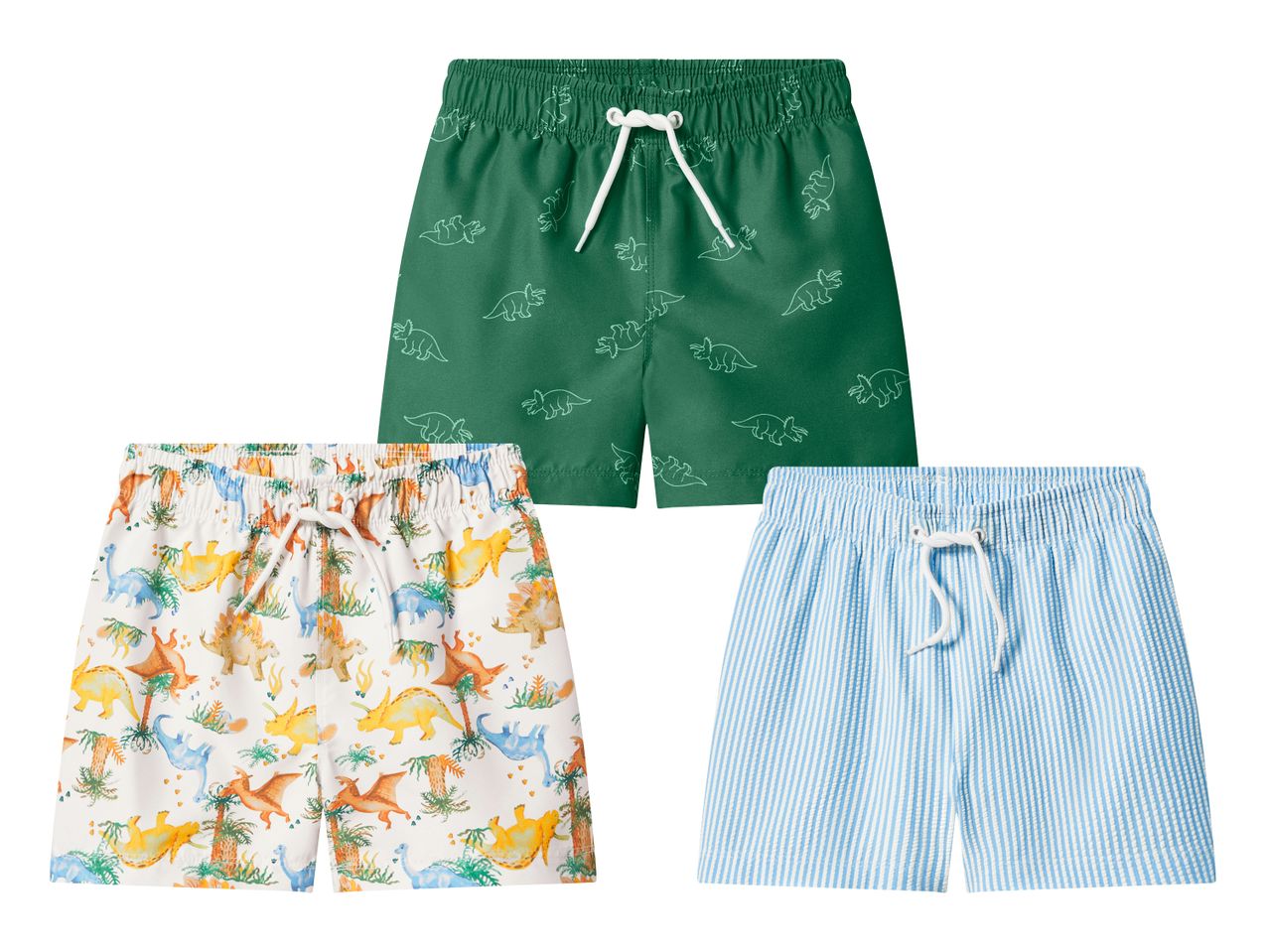 Drei Badeshorts für Kinder: eine grüne mit Dinosauriern, eine weiße mit bunten Dinosauriern und Palmen, und eine hellblau-weiß gestreifte.