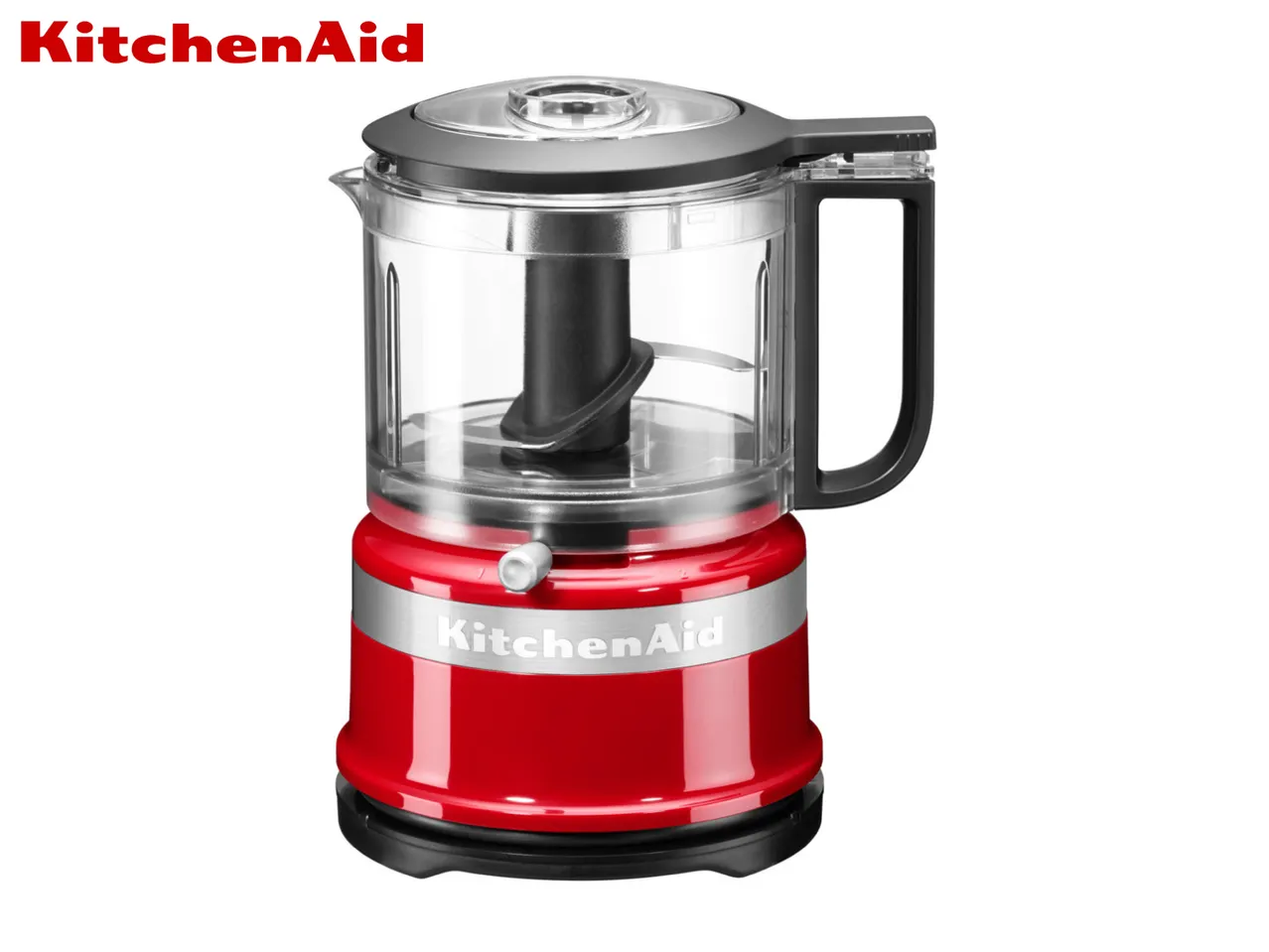 Red food chopper with a clear bowl and black handle, featuring a silver band.