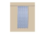 Blue and white seashell pattern shower curtain hanging on a silver rod against a beige wall.