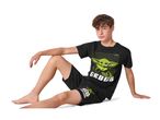 Boy in black Grogu pyjamas, featuring a large Grogu print on the t-shirt.