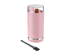 Um moedor de café rosa Silvercrest com uma escova de limpeza.
