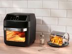 SilverCrest air fryer with a whole chicken inside, and a basket of french fries