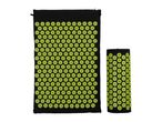 Two black and green acupressure mats, one flat and one rolled up.