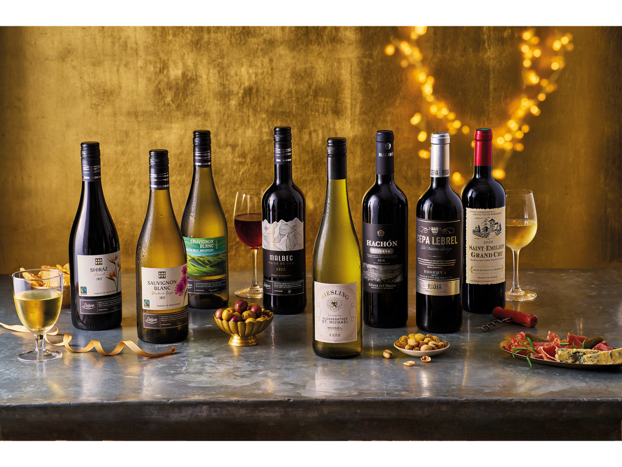 A selection of fine wines from various regions, including South African Sauvignon Blanc and Shiraz, Argentinian Malbec, and Spanish Rioja.