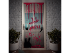 A Halloween door decoration with fake blood, handprints, and the text 'NOONE LEAVES!'