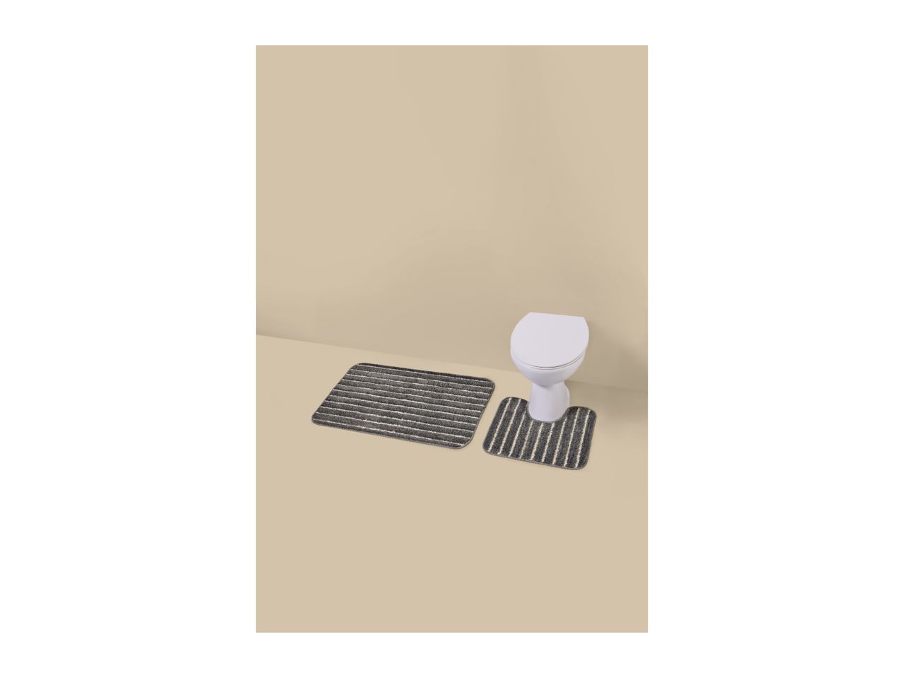 Bathroom mat set with toilet mat and rectangular mat in grey with white stripes.