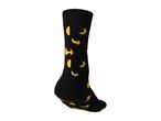 Black crew sock with a yellow banana pattern