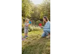 Lupilu Outdoor Toy Sets: Mother and child playing with catch ball toys in a sunny garden.