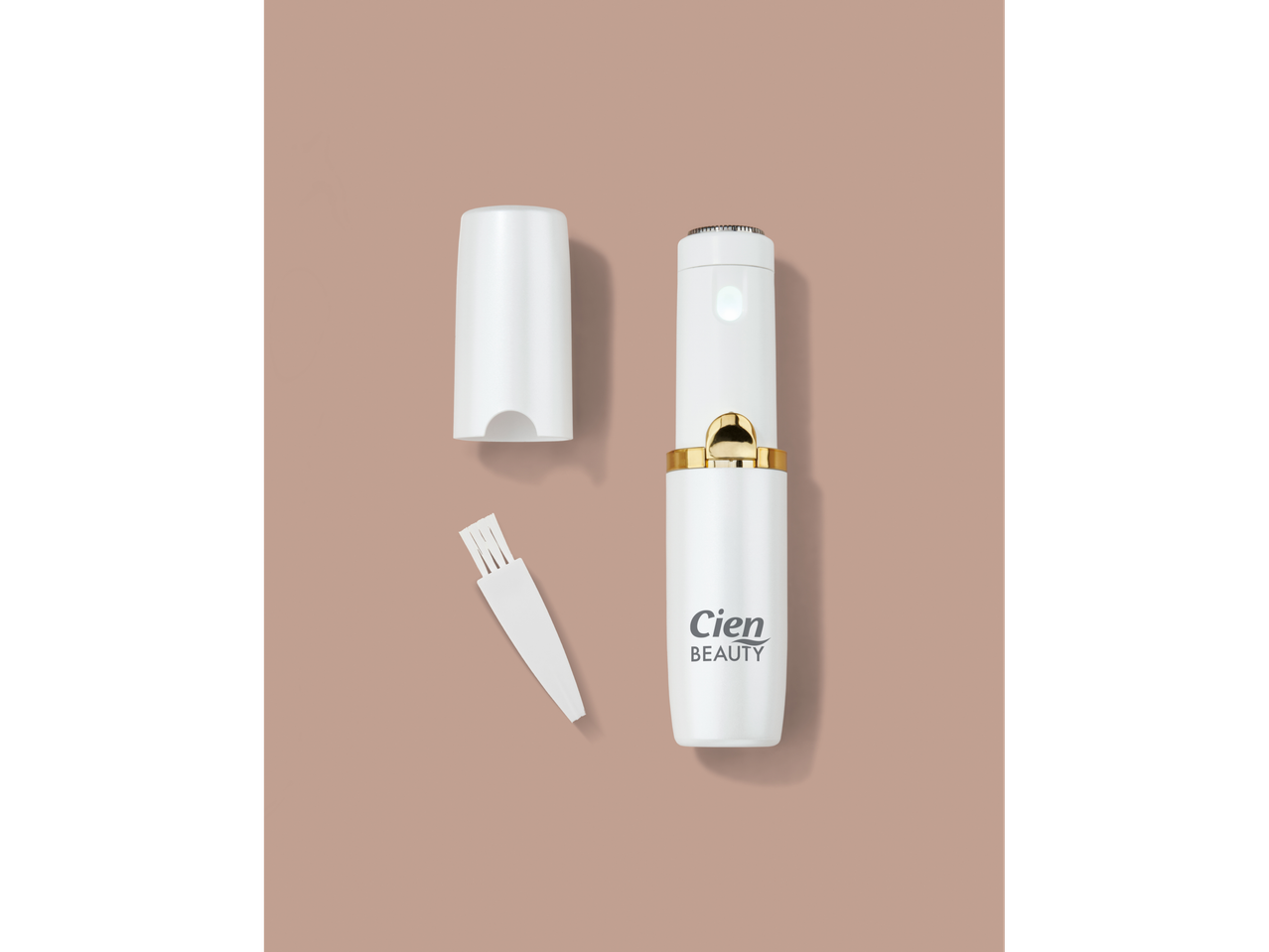 Cien BEAUTY Facial Hair Remover, white with gold accents, and a cleaning brush on a beige background.