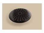 Close-up of a black round shower head with many small nozzles on a beige background.