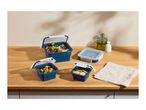 Blue collapsible food containers with salad, olives, and crackers on a wooden counter.