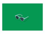White sunglasses with dark lenses on a green background.