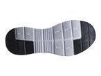 Bottom view of a black and white shoe sole with a textured pattern for grip.