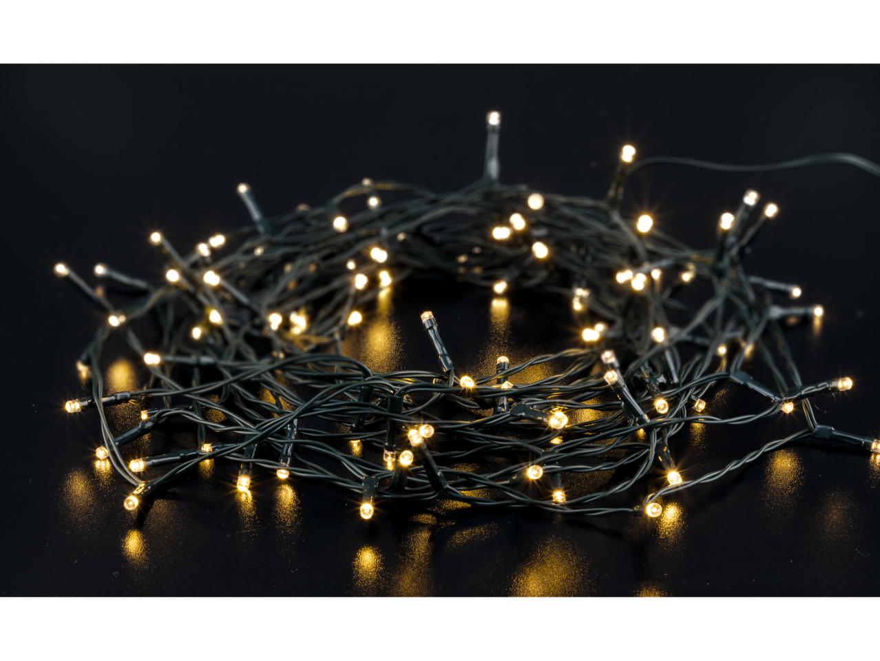 LIVARNO home LED String Lights, warm white, tangled on a dark surface.