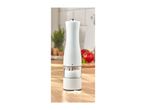 Electric salt or pepper mill on a wooden kitchen counter