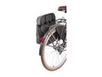 Rear view of a bicycle with a brown seat, a black pannier bag, and a red reflector.