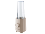 Beige personal blender with a clear blending cup and a control knob on the front.