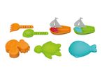 Colorful beach toys including a rake, shovel, two sailboats, an orange crab, a green turtle, and a blue whale.