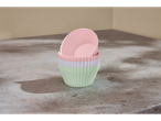 Conjunto de forminhas de silicone para muffins em cores pastel sobre uma mesa cinza.