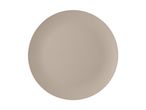 A single, round, light brown dinner plate on a white background.