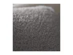 Close-up of a soft, grey, textured fabric, possibly a blanket or towel.