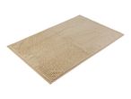 A beige bath mat with a textured surface.