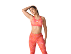 Sutiã desportivo e leggings Crivit com padrão vibrante laranja e rosa.