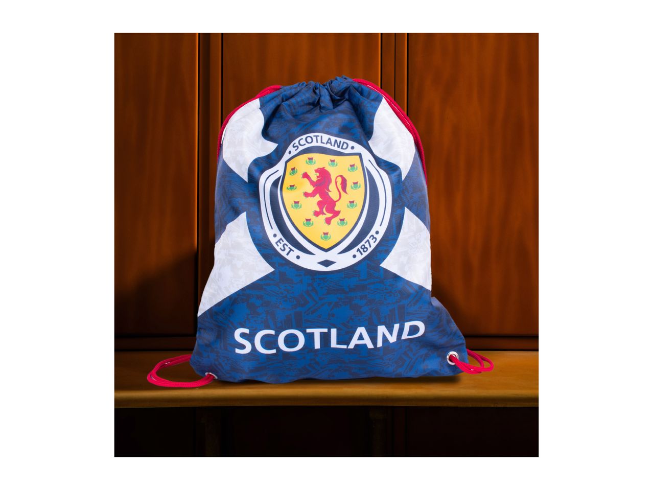 Blue and white Scotland drawstring bag with a lion rampant crest and 'SCOTLAND' text.