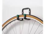 Wall-mounted bike hook with vintage wheel.