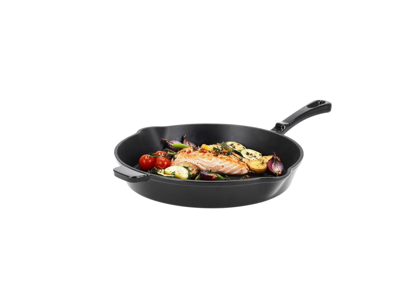 Black cast iron pan with cooked salmon and roasted vegetables.