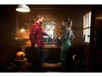 Man and woman in a workshop with a Parkside chainsaw.