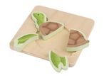 Wooden turtle puzzle with several pieces removed from the board.