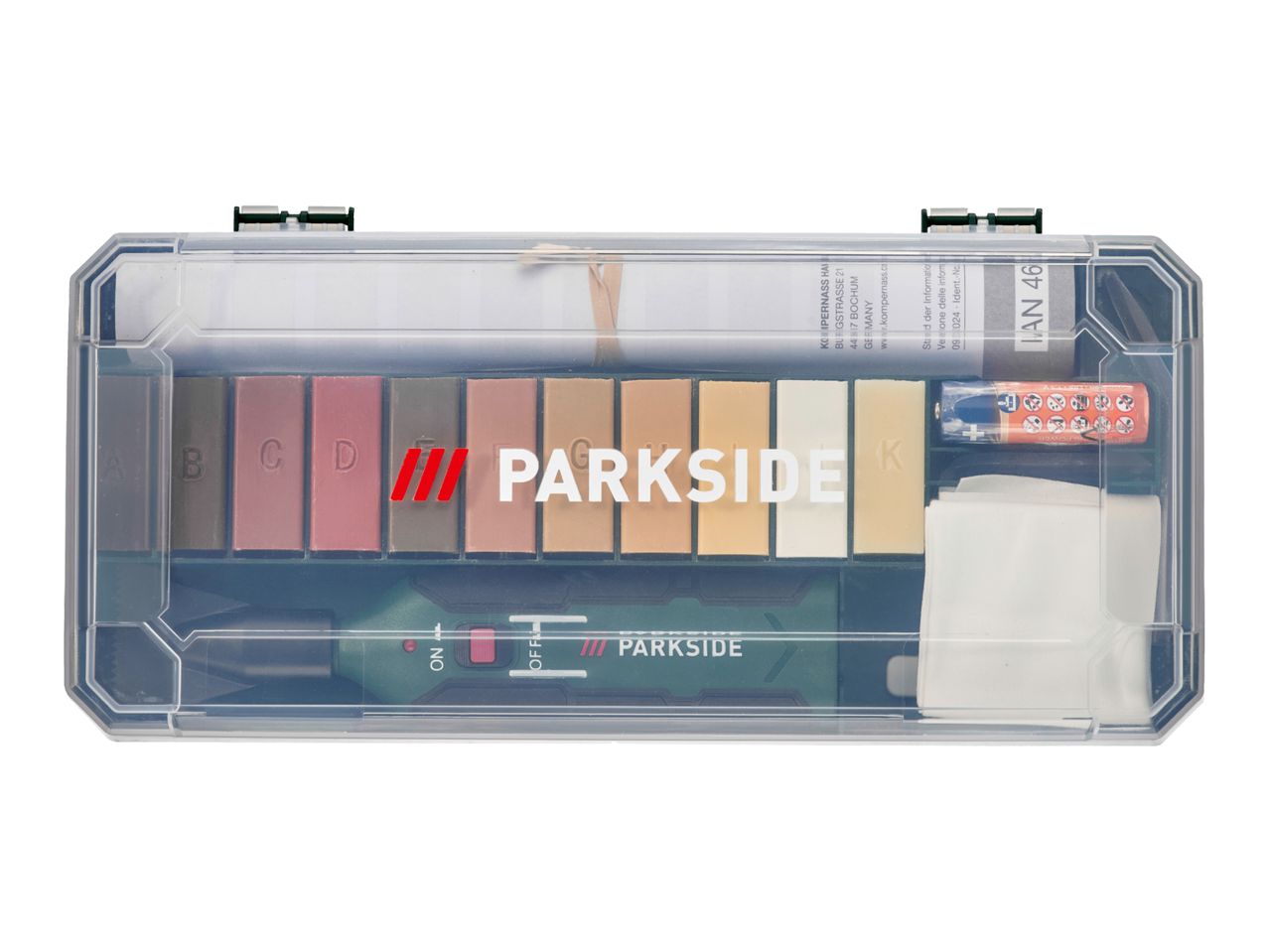 Repair kit with various colored wax sticks, a battery-powered tool, and cleaning cloths.