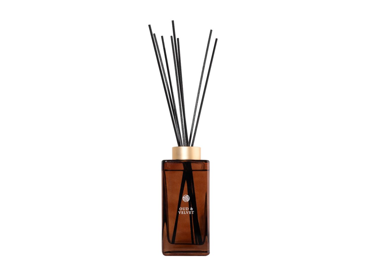 Oud & Velvet reed diffuser in a brown glass bottle with a gold cap