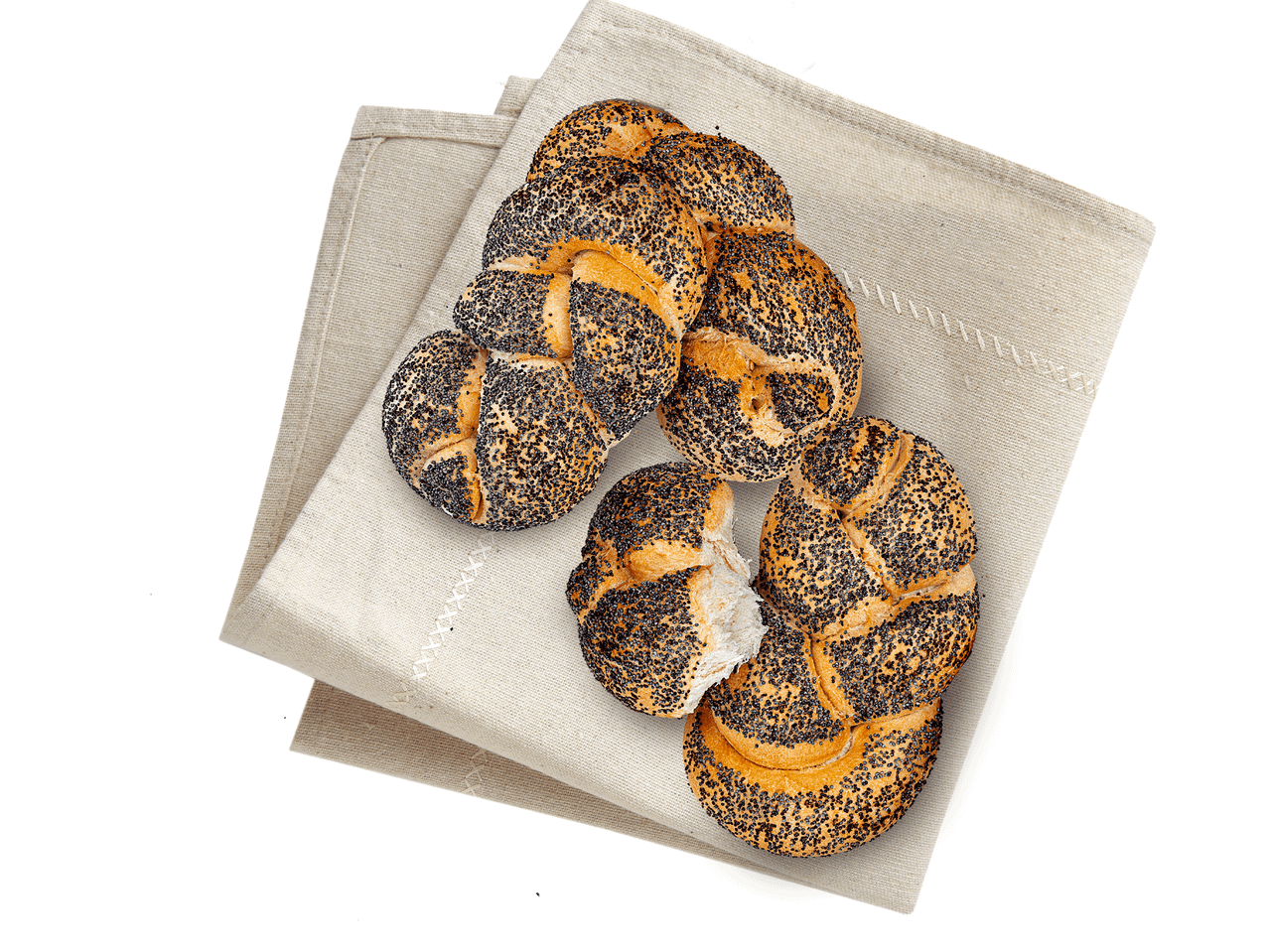 Mohnbrötchen auf einem Leinen-Servietten.