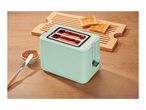 Mint green toaster with toast and jam on a wooden table.