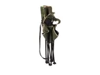 Folded green camping chair with black frame and strap, standing upright.