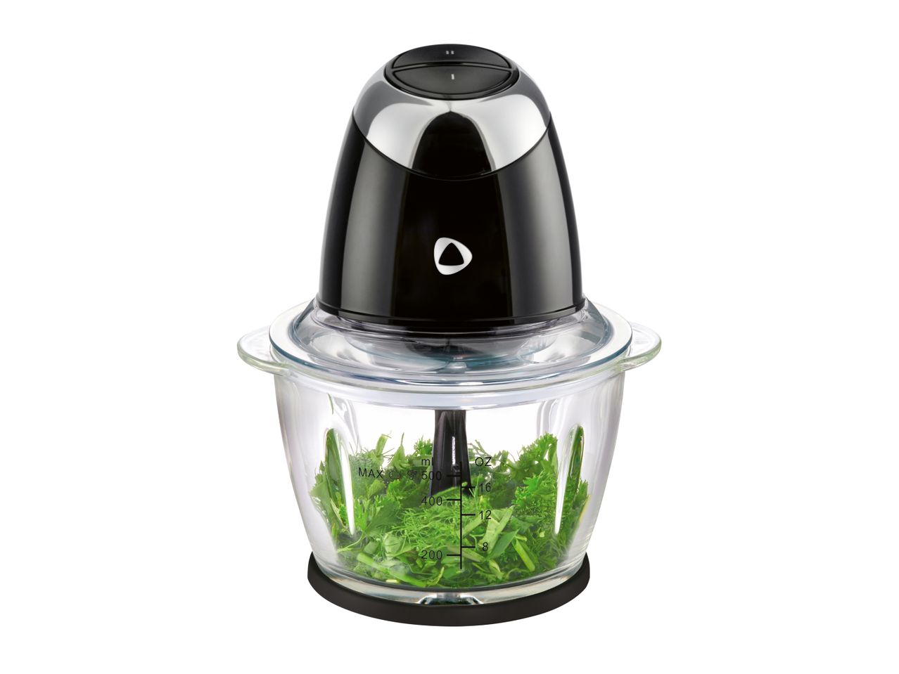 A black and silver food chopper with a glass bowl filled with chopped green herbs.