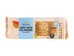 A package of Rivercote Lightly Salted Rice Crackers, showing nutritional information.