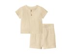 Light beige muslin short-sleeved shirt and matching shorts set for babies.