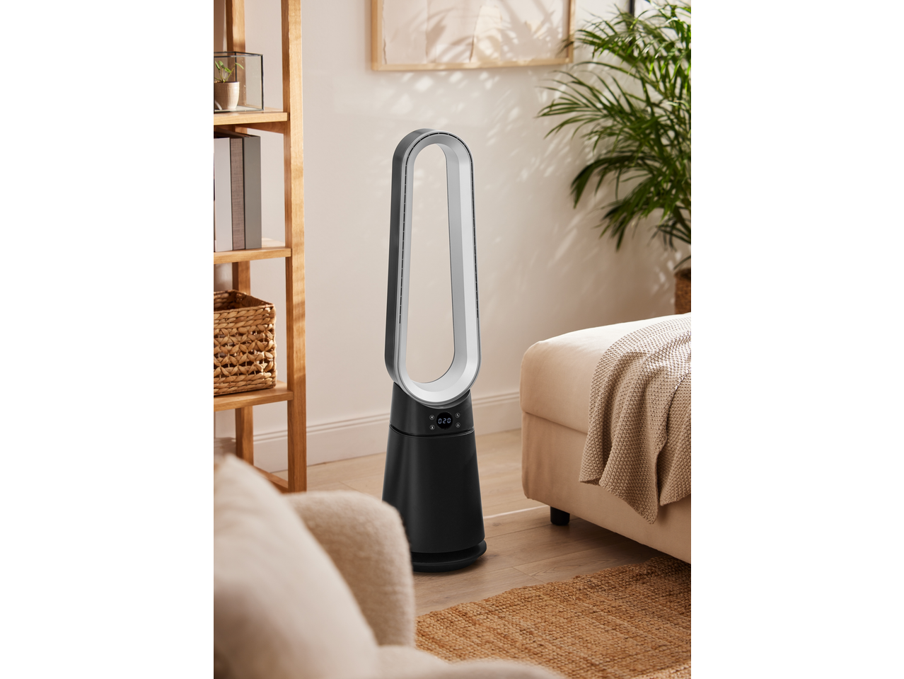 A modern bladeless fan in a cozy living room with a wooden shelf and a sofa.