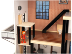 Dollhouse with working elevator and figurines.